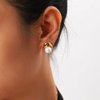 gold plated pearl cradle stud earring worn on the ear