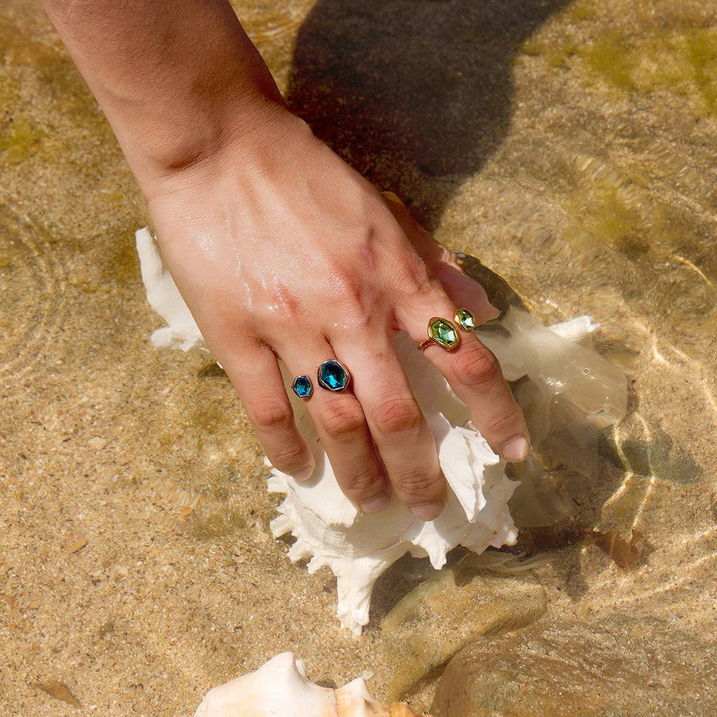 Open stone rings styled against a shell