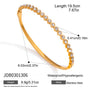 Graduated round clear accent gold-tone stainless steel bangle