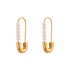 Stainless steel imitation pearl pin earrings isolated on white