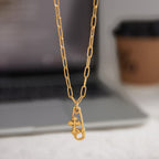 paperclip chain necklace with safety pin and cross charms