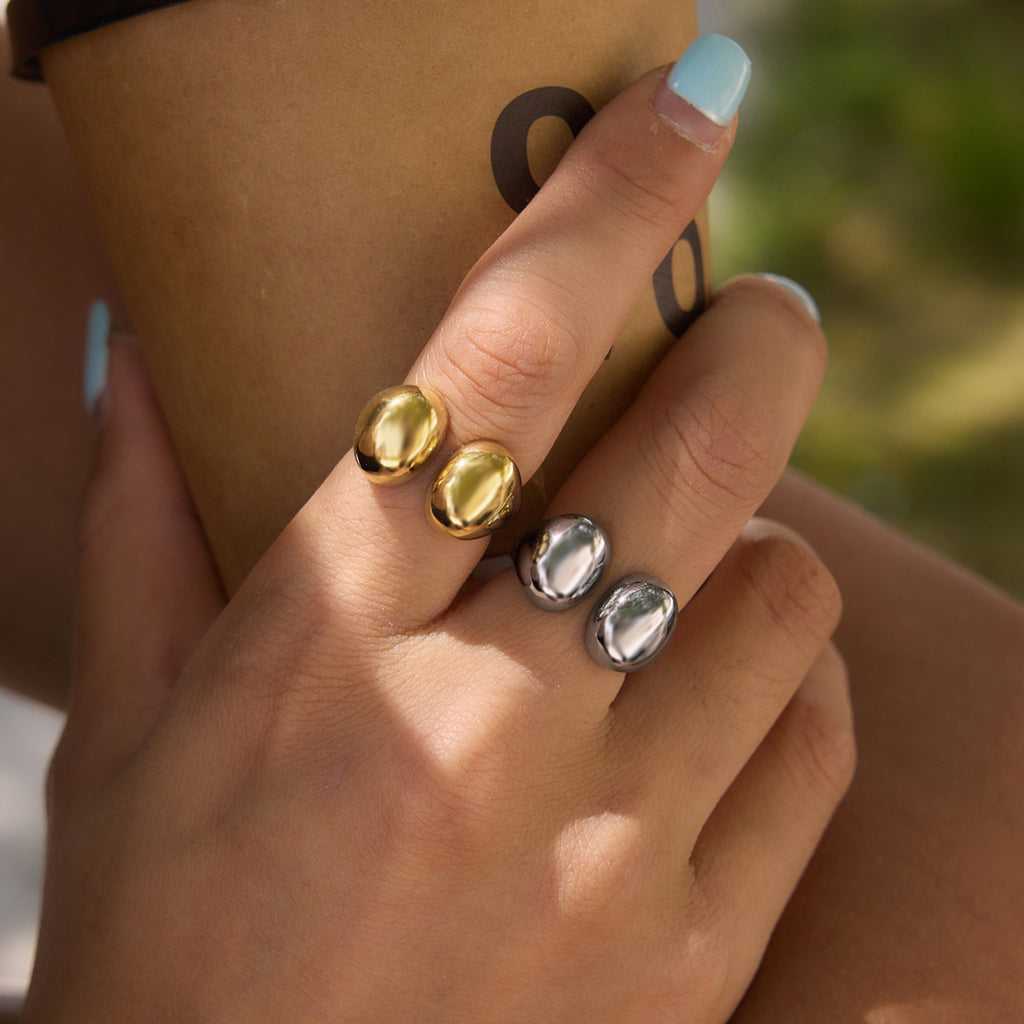 Double pebble rings shown on a model hand