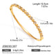 Alternating polished and clear round accent stainless steel bangle