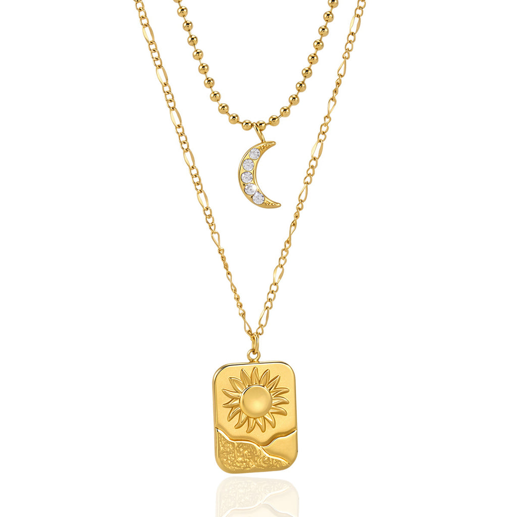 Clear-stone crescent and rectangular sun pendant on white