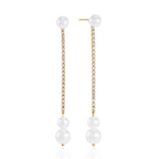 Front view of long earrings with clear stones and white glass pearls