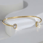front view of slim cuff with two oval clear stone ends