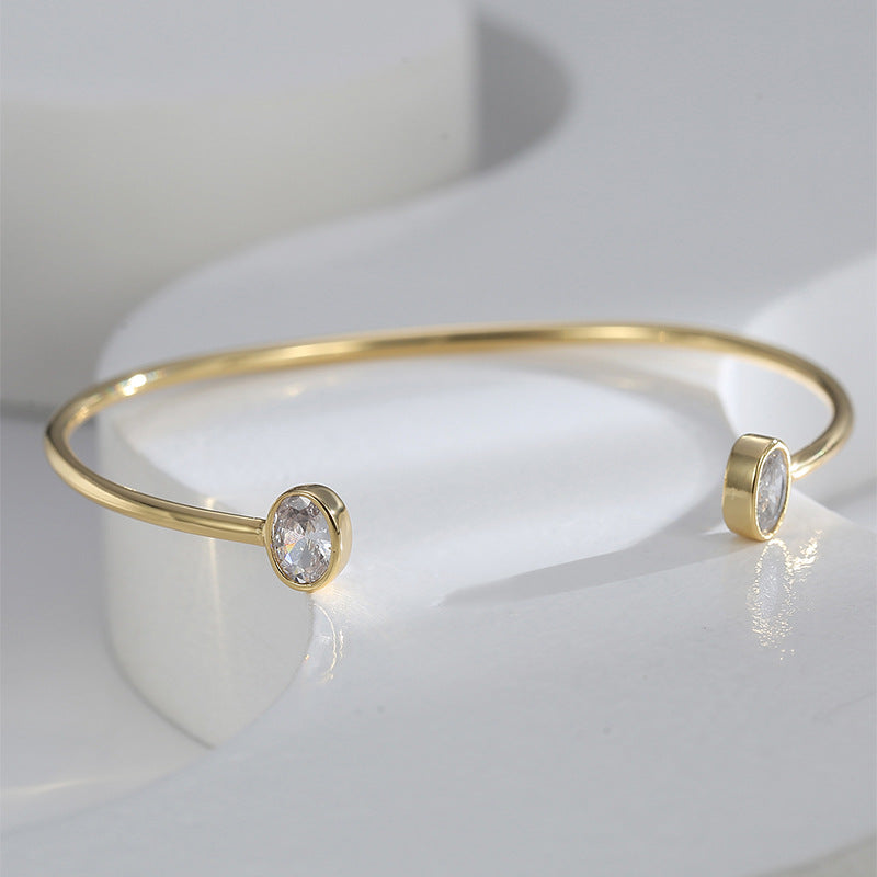 front view of slim cuff with two oval clear stone ends