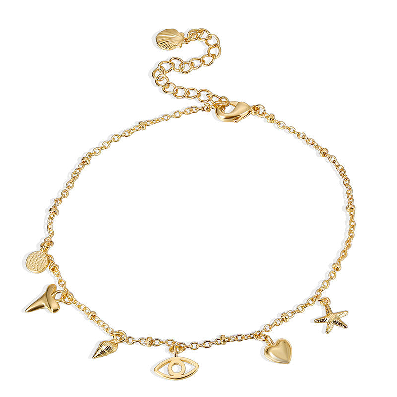 isolated mixed ocean charm anklet with extension chain