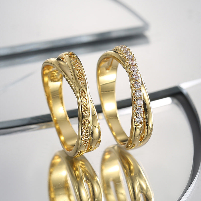 engraved and zirconia crossover rings standing on a mirror