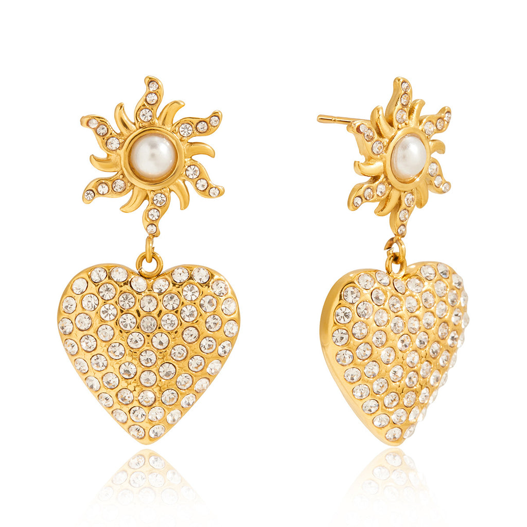 Front view of gold-tone heart drop earrings with white bead