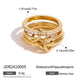 Layered gold-tone ring with connecting loops and clear accents