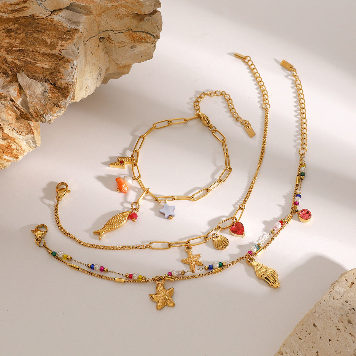 Gold Plated Stainless Steel Ocean Charm Bracelet Collection — styled view