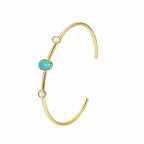 isolated gold plated brass turquoise-color cuff bracelet