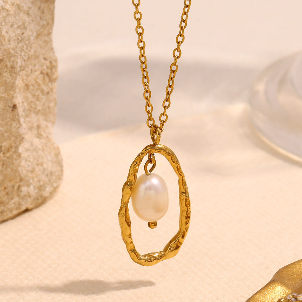 gold plated stainless steel hammered oval necklace with white pearl-style bead