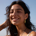 Fish drop earrings styled outdoors