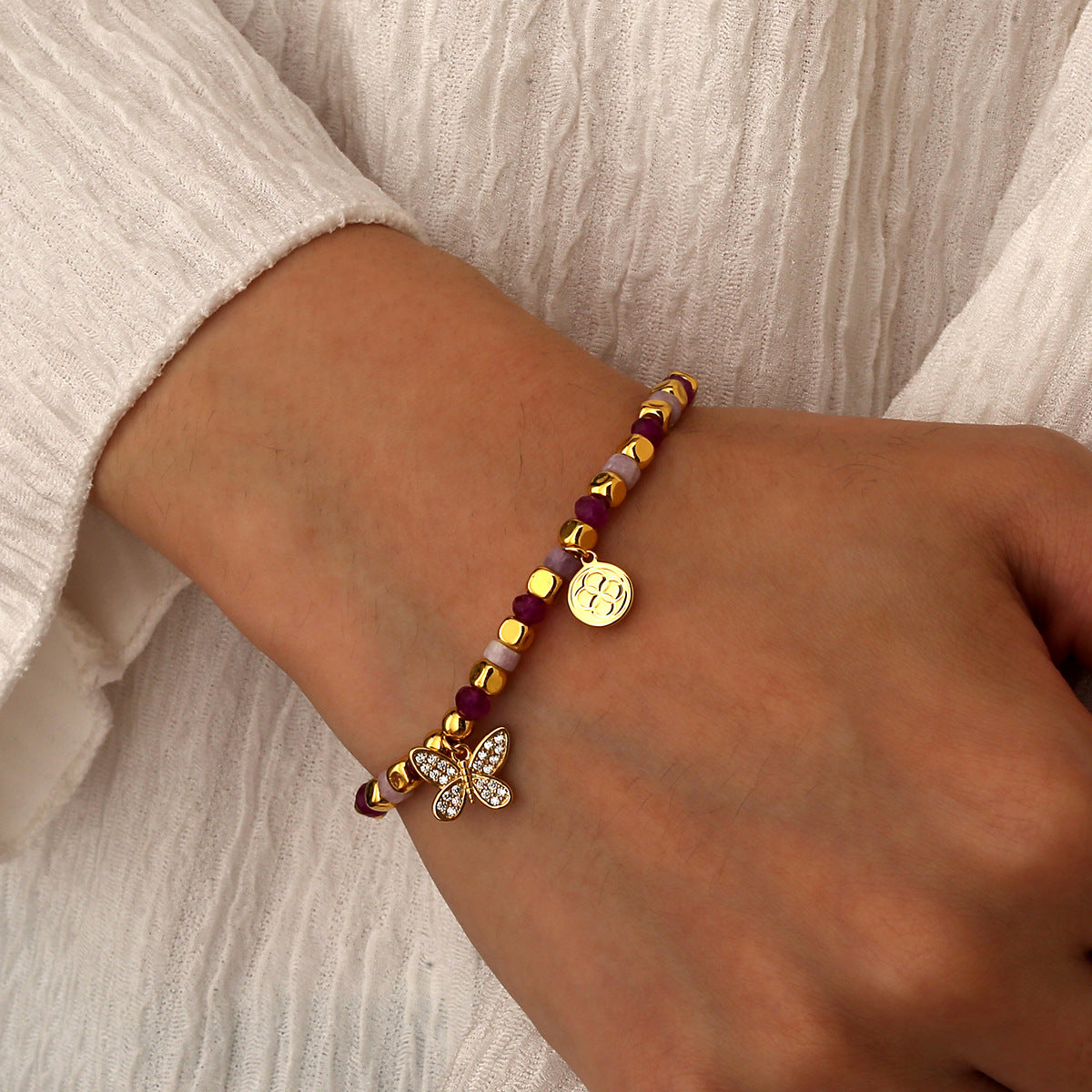 model wearing the gold plated pink butterfly bead bracelet