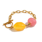 Yellow and pink resin bead bracelet with front toggle clasp