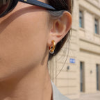 side profile of gold plated C hoop with silver-finish ring