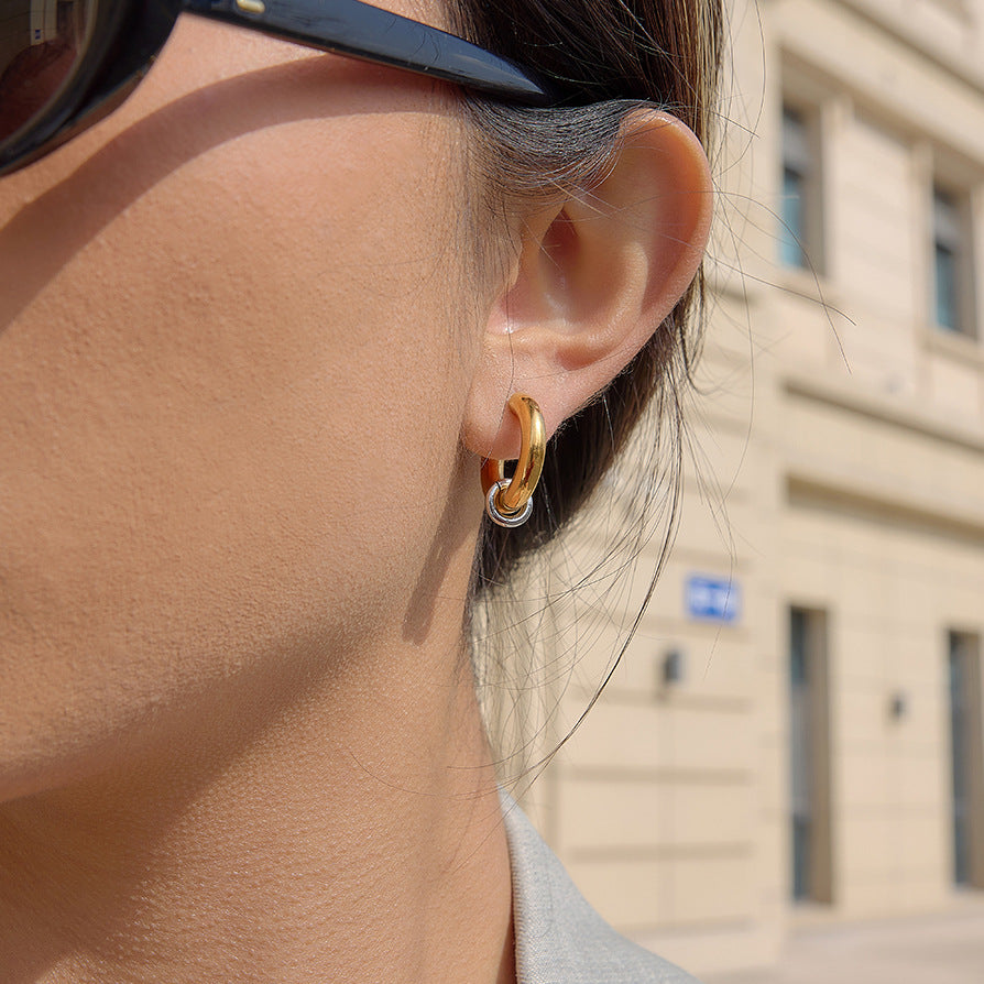 side profile of gold plated C hoop with silver-finish ring