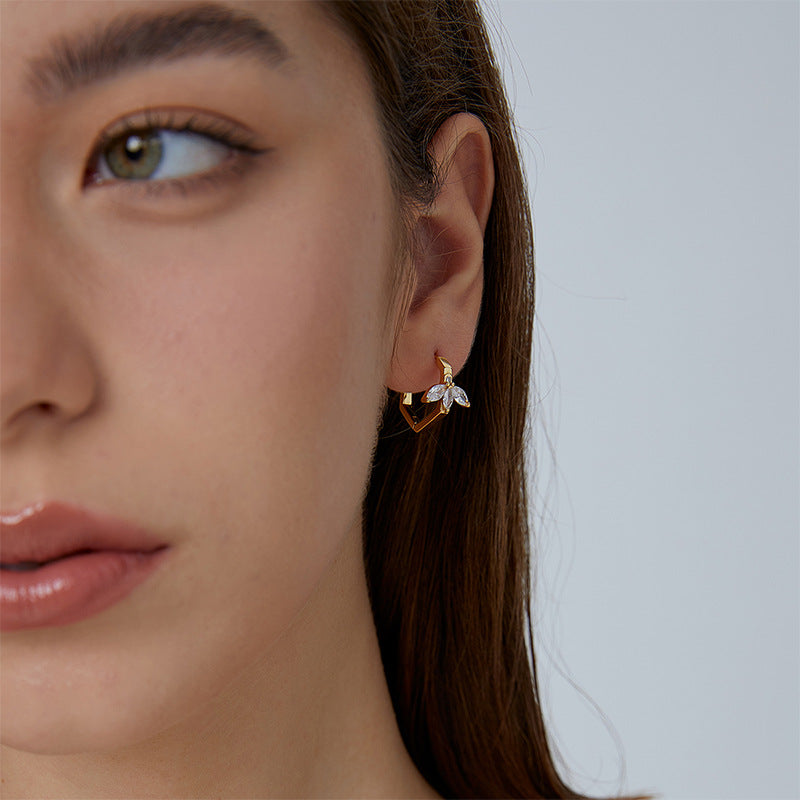 marquise leaf zirconia huggie hoop earring worn on the ear