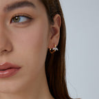 marquise leaf zirconia huggie hoop earring worn on the ear