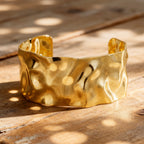 wide open cuff with irregular dimpled texture in warm natural light