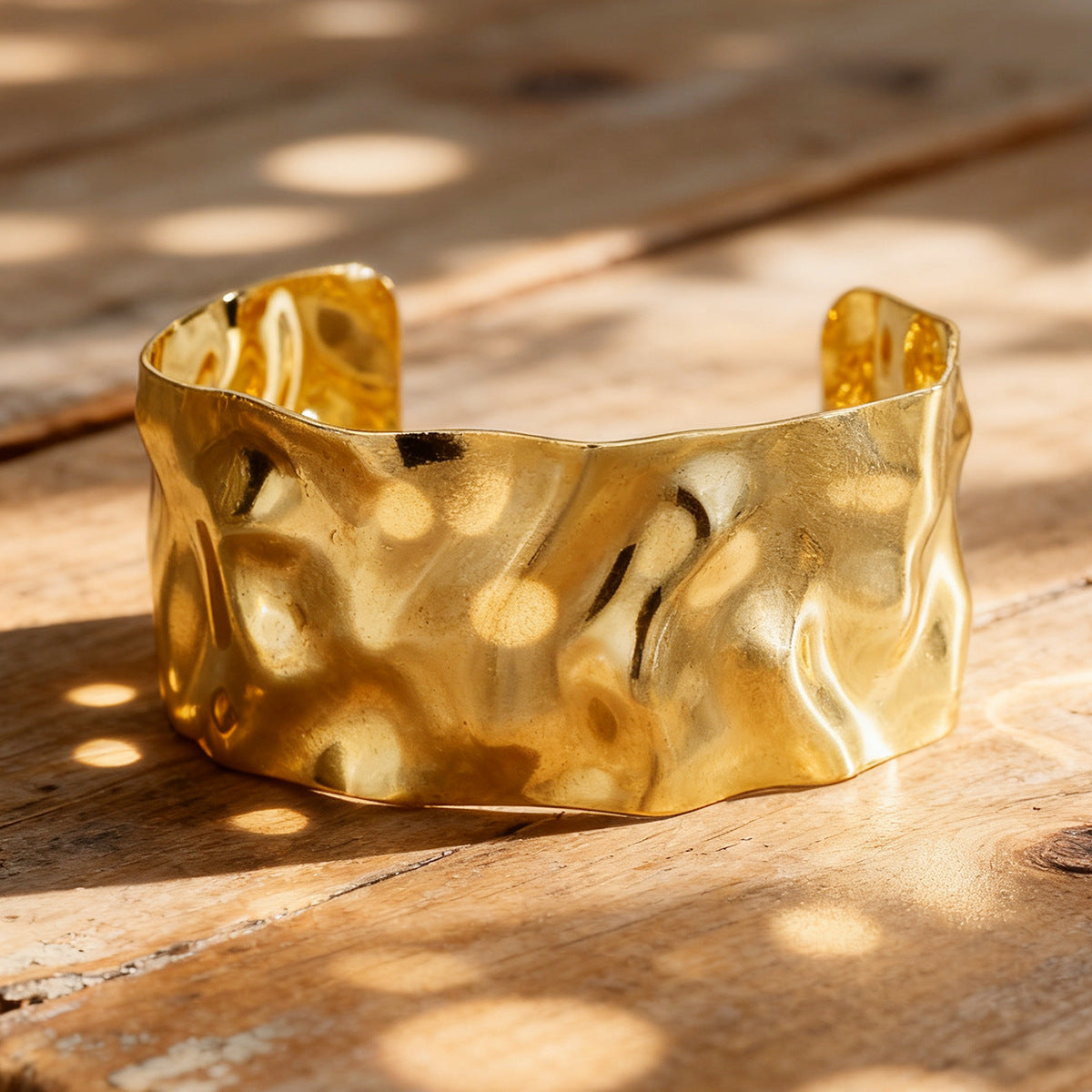wide open cuff with irregular dimpled texture in warm natural light