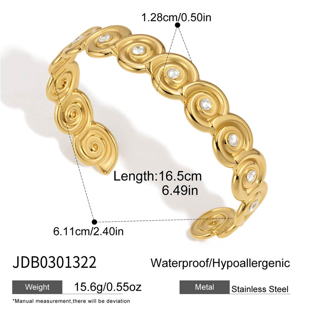 Broad polished spiral cuff with clear centers