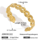 Broad polished spiral cuff with clear centers