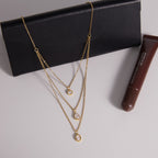 Layered necklace arranged on a black display