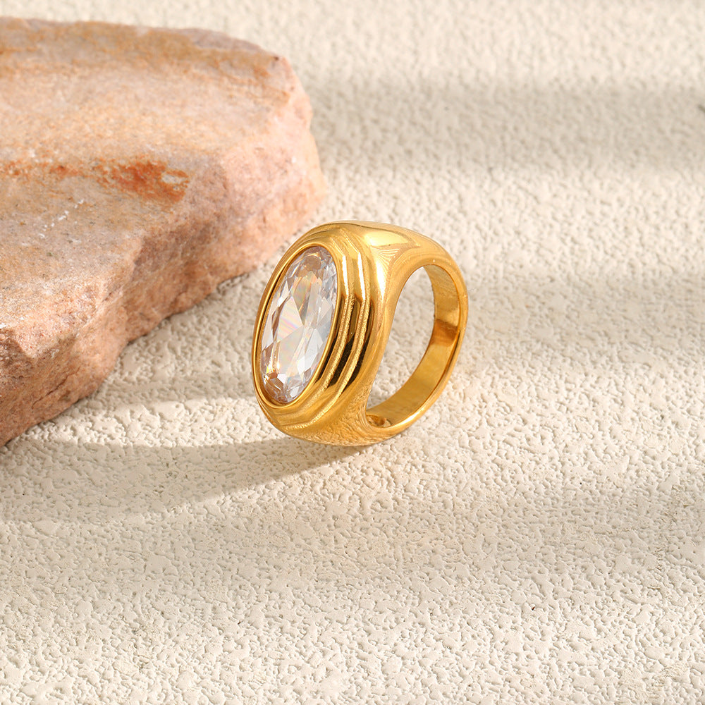 gold plated 316L stainless steel ring with oval clear stone