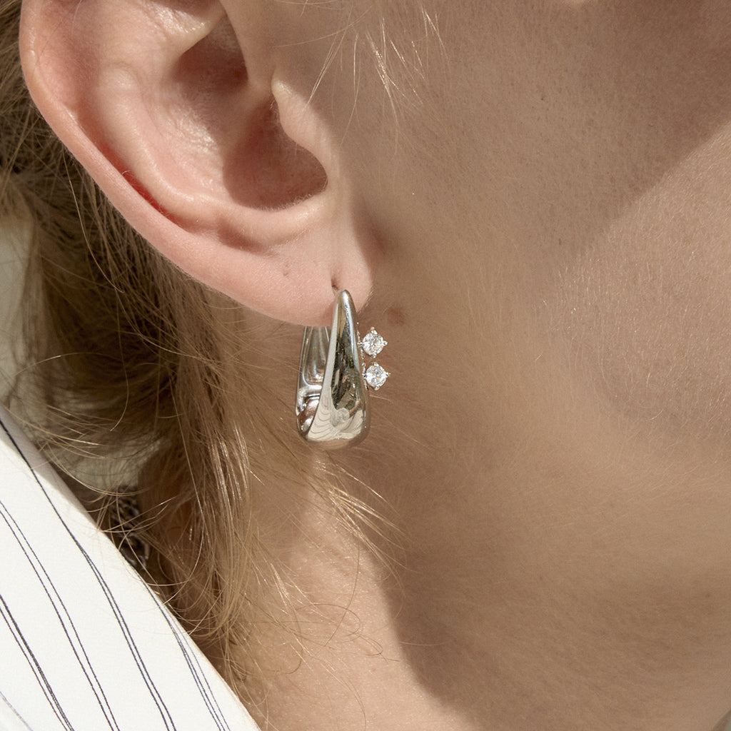 Steel color tapered hoop worn close-up