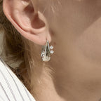 Steel color tapered hoop worn close-up