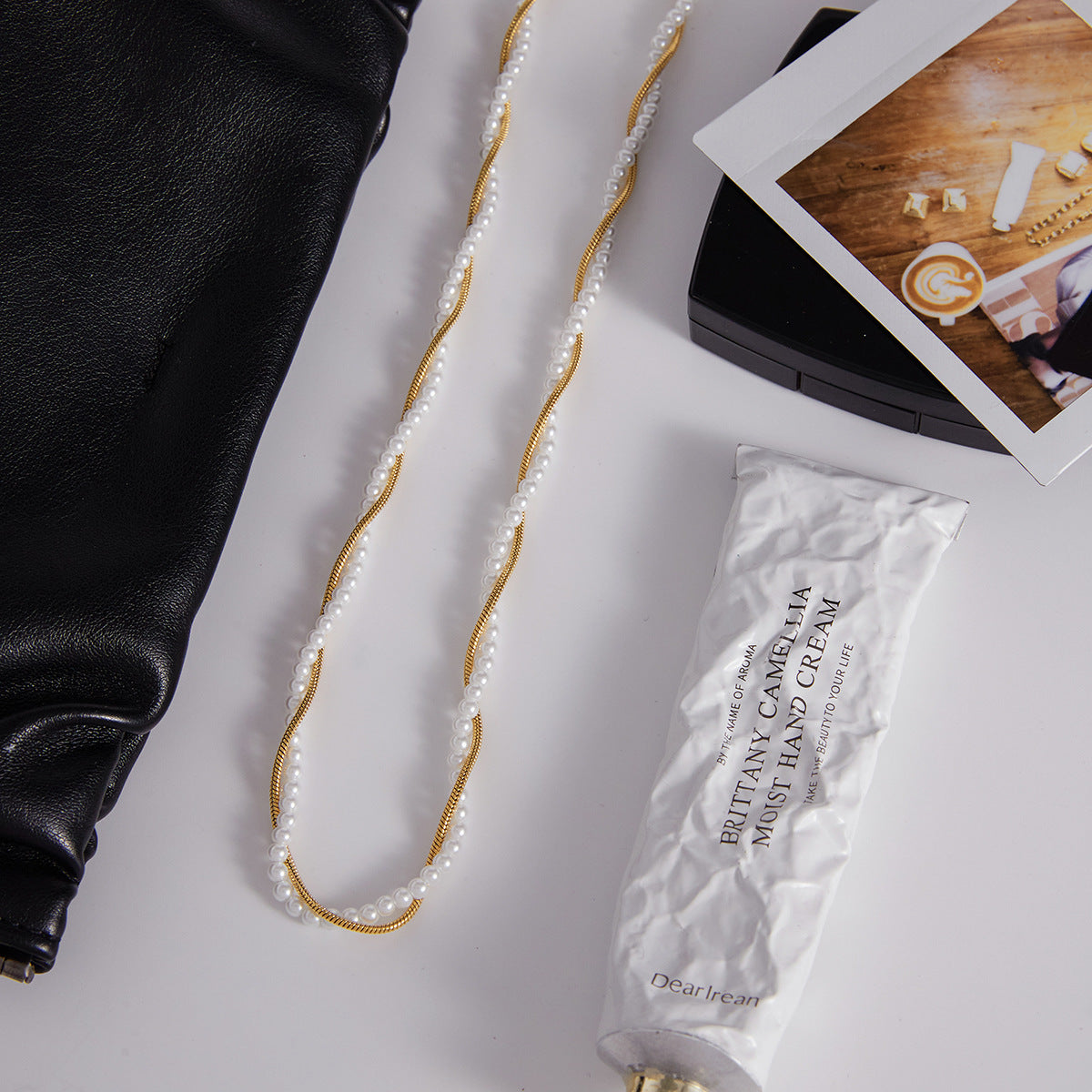 Gold-Tone Layered Stainless Steel Necklace and Huggie Earring Collection close-up product view