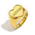 isolated gold plated stainless steel mama heart signet ring