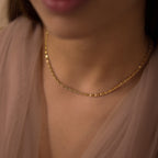 Compact ornate-link chain worn around the neck
