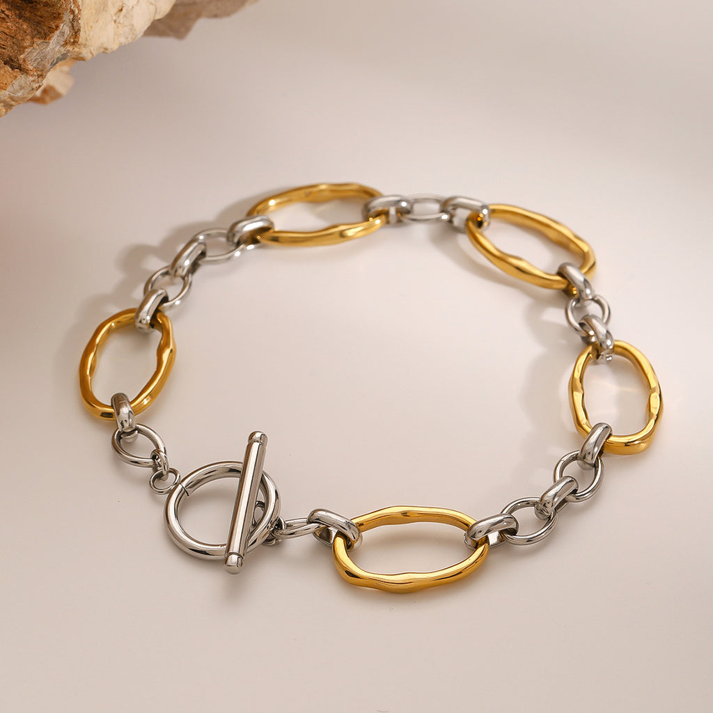 Two-tone stainless steel oval link toggle bracelet front view