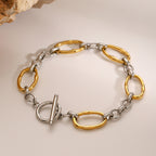 Two-tone stainless steel oval link toggle bracelet front view