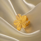 Five-petal open ring showing its raised flower face