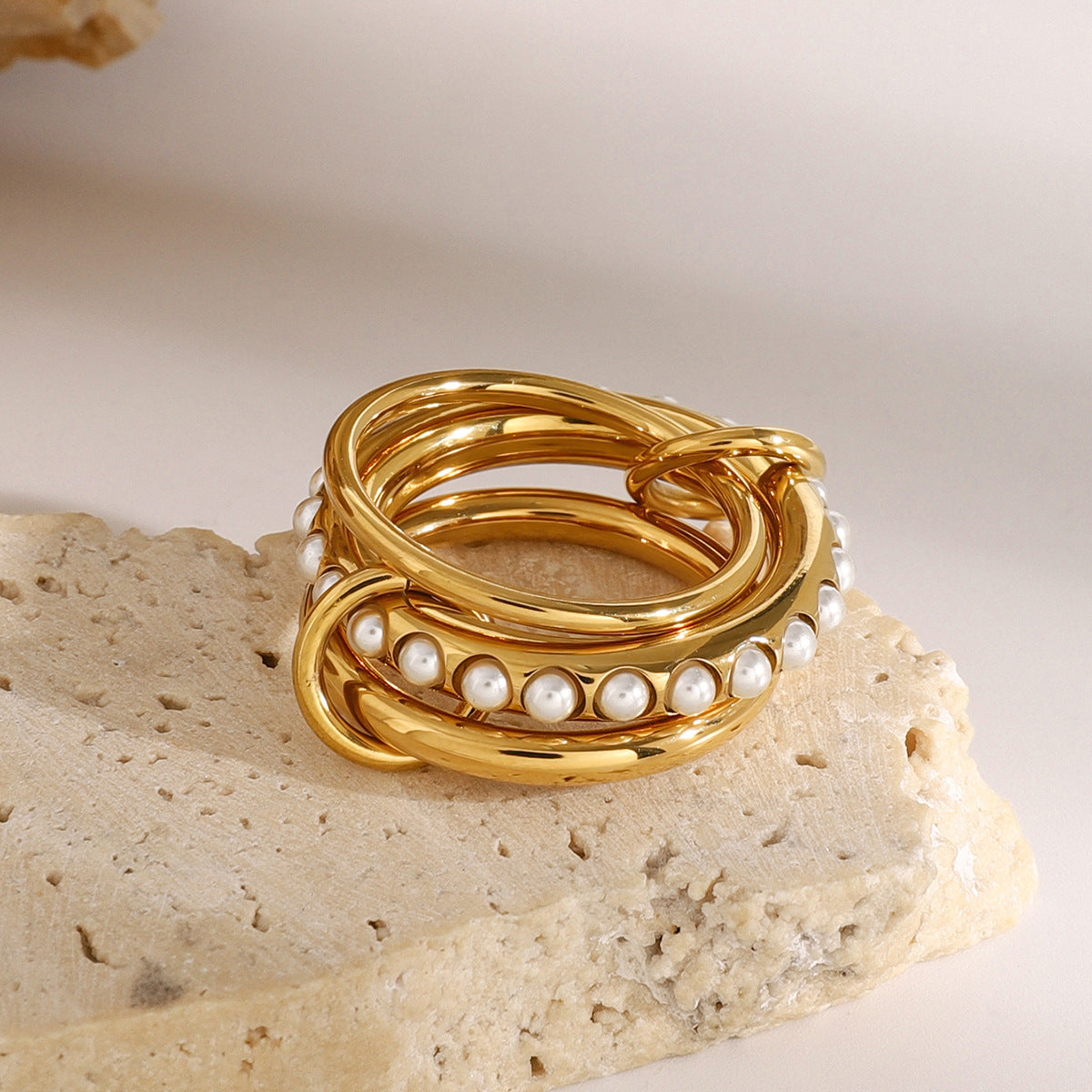 Three connected rings arranged together on a stone block