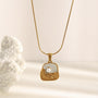 gold plated botanical plaque necklace with imitation pearl accent