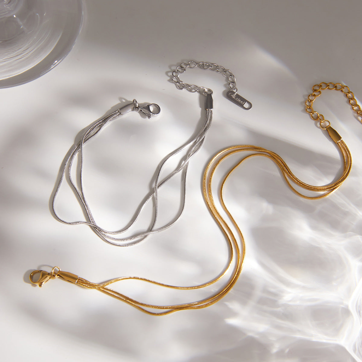 Gold and steel color layered snake chain bracelets