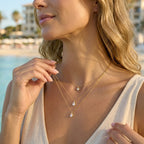 Three fine necklace layers shown from another model angle