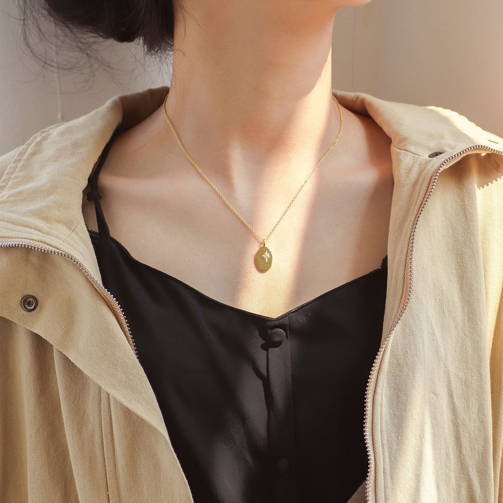 oval starburst necklace worn with a 45 cm chain