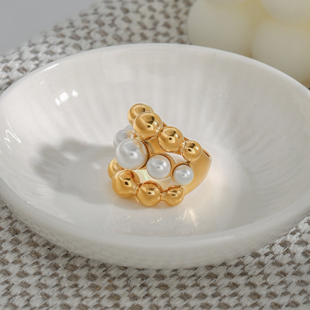 White center bead row between two gold rows on a ring