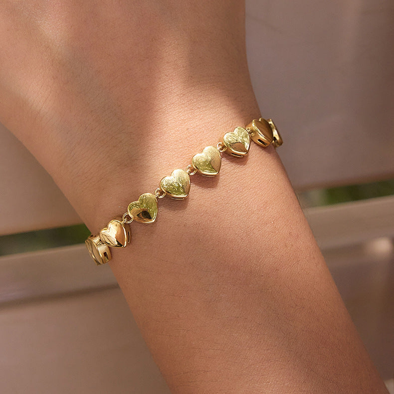 Repeating polished heart links shown in close-up