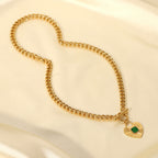 full view of the chunky gold plated heart toggle necklace on satin