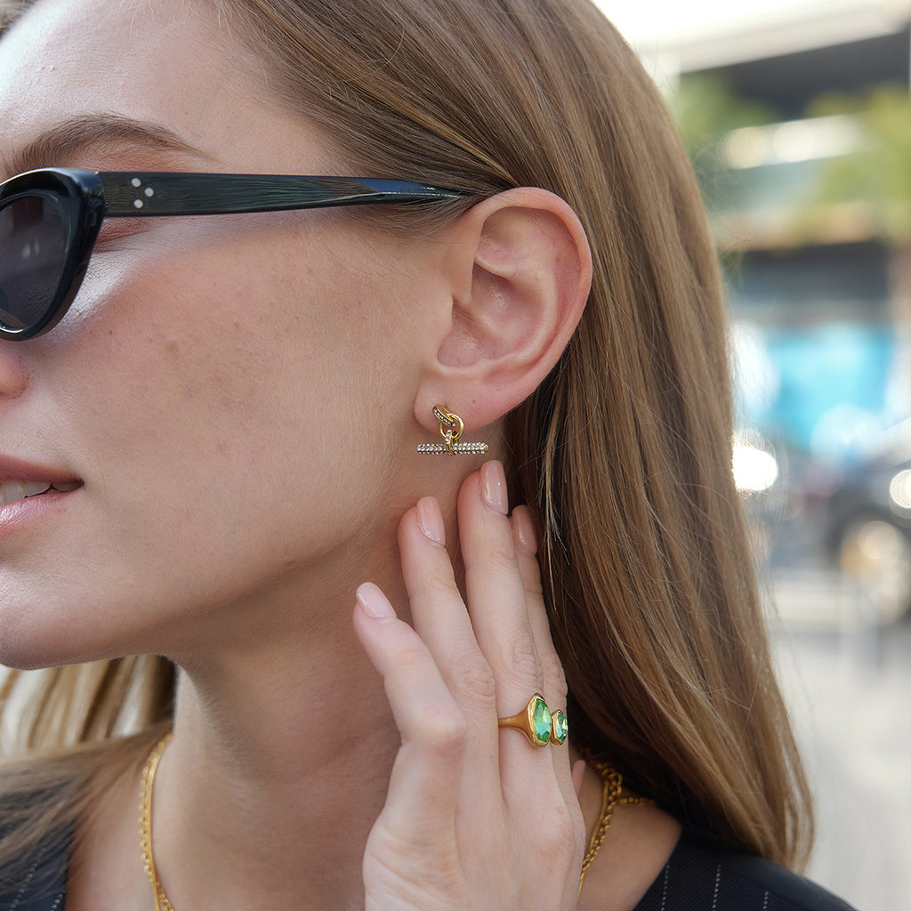 Short T-bar earrings styled on a model