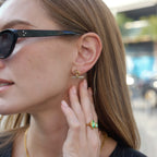 Short T-bar earrings styled on a model