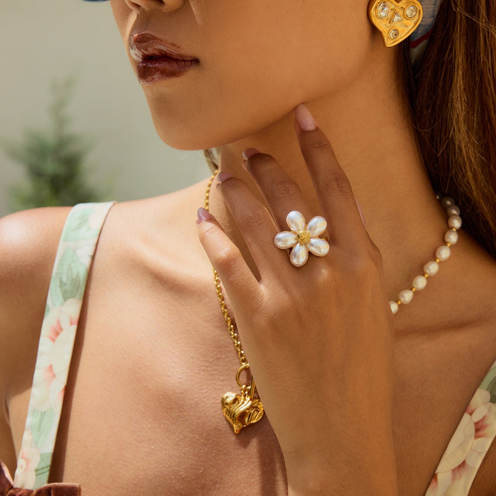White petal flower ring styled on a model hand